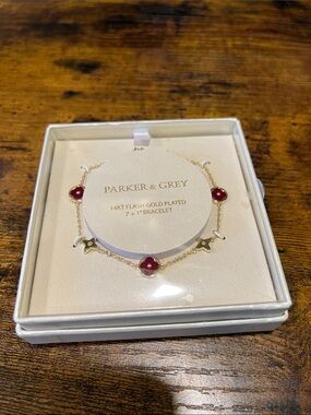 Parker Gold Plated Bracelet with Red Floral Charms